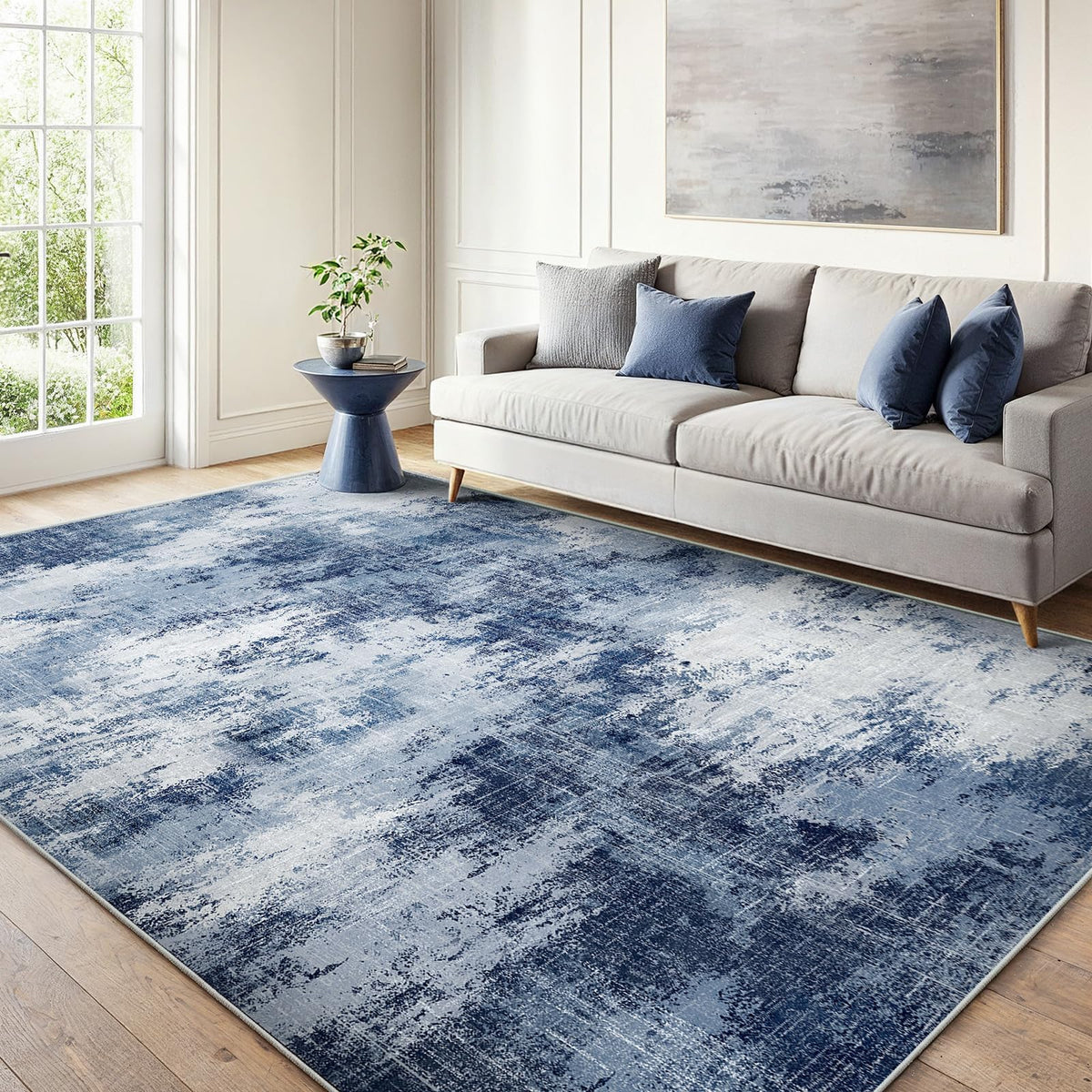 AMADA HOMEFURNISHING 6x9 rug with abstract pattern adds texture to living room.