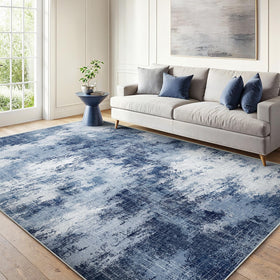 AMADA HOMEFURNISHING 6x9 rug with abstract pattern adds texture to living room.