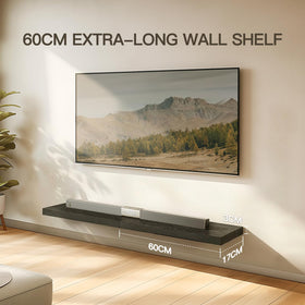 AMADA black shelves pair with wood tones for a modern bedroom display.