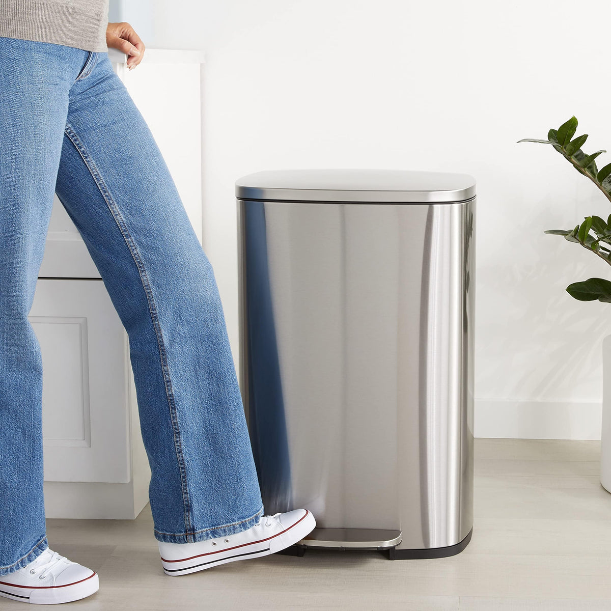 Amazon Basics 50L trash can lid open showing soft-close mechanism