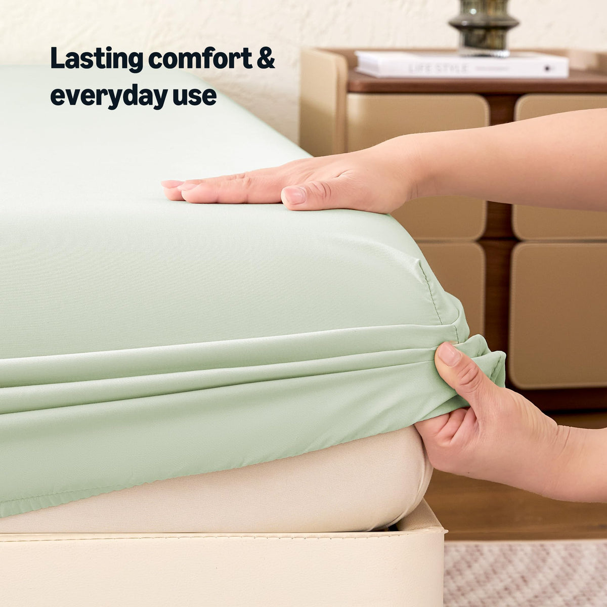 Amazon Basics Aloe Green close-up fabric shows soft recycled polyester fibers.