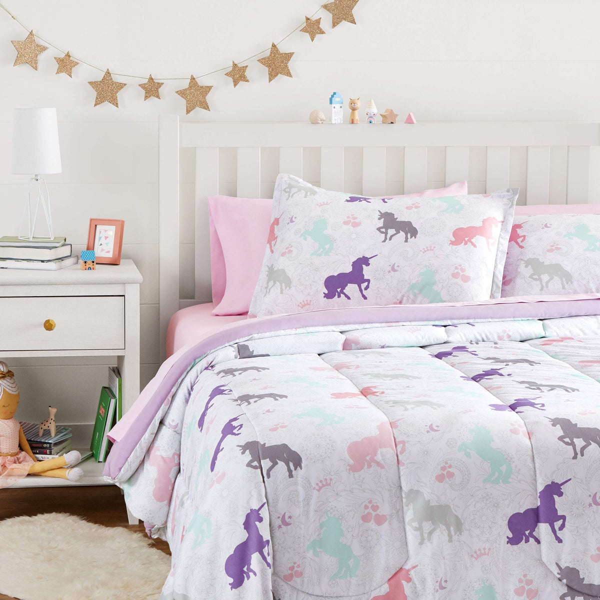 Amazon Basics bed-in-a-bag unicorns comforter close-up showing plush warmth for all-season use