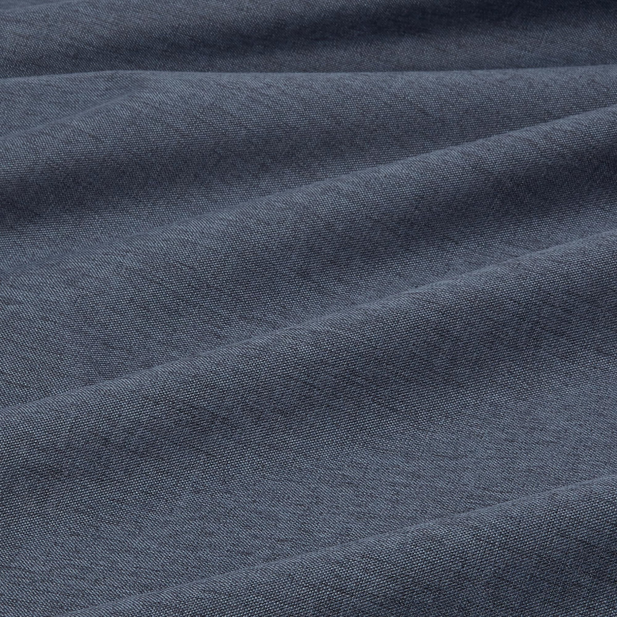 Amazon Basics navy panel with grommets emphasizes easy hanging and durability