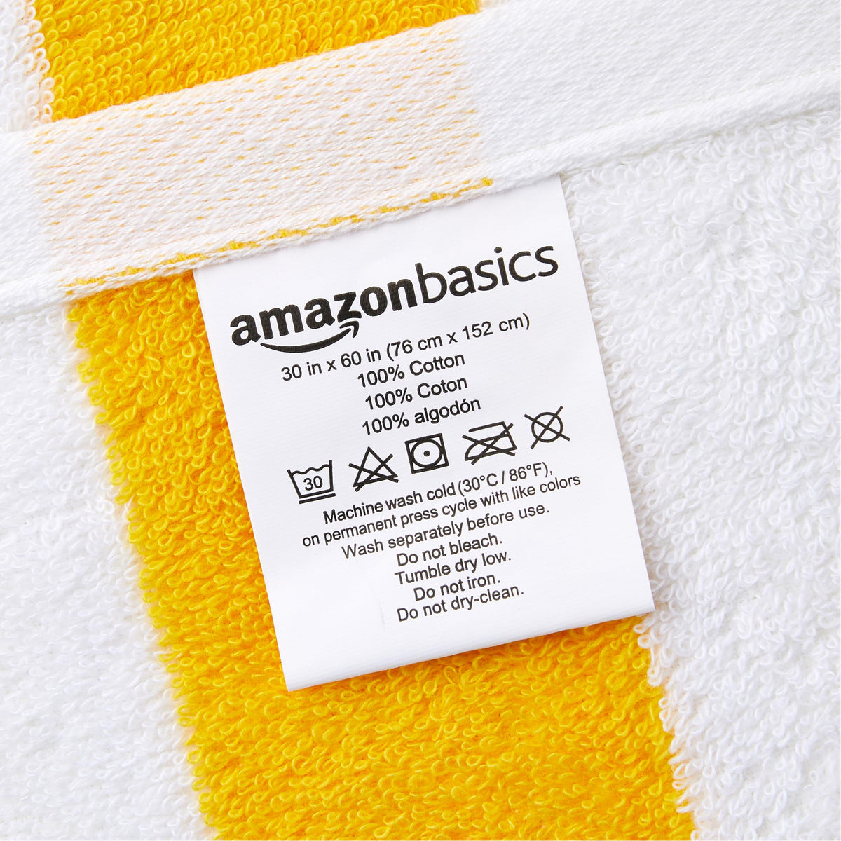 Amazon Basics cabana stripe towel at the beach scene, ready for sun and sand.