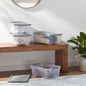Amazon Basics stackable bin shown under-bed storage for space-saving organization.