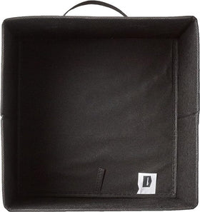 Amazon Basics collapsible bin on a shelf showing organized cubbies.