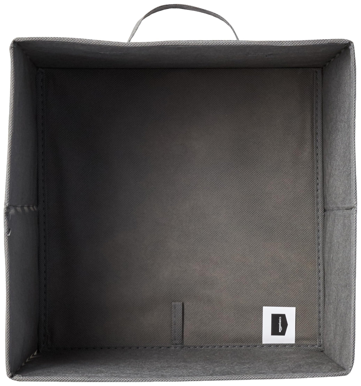 Amazon Basics collapsible storage bin nestled in cubbies demonstrates modular organization.