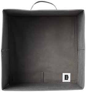 Amazon Basics collapsible storage bin nestled in cubbies demonstrates modular organization.