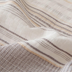 Amazon Basics care tips show washing in a mesh bag on gentle cycle.