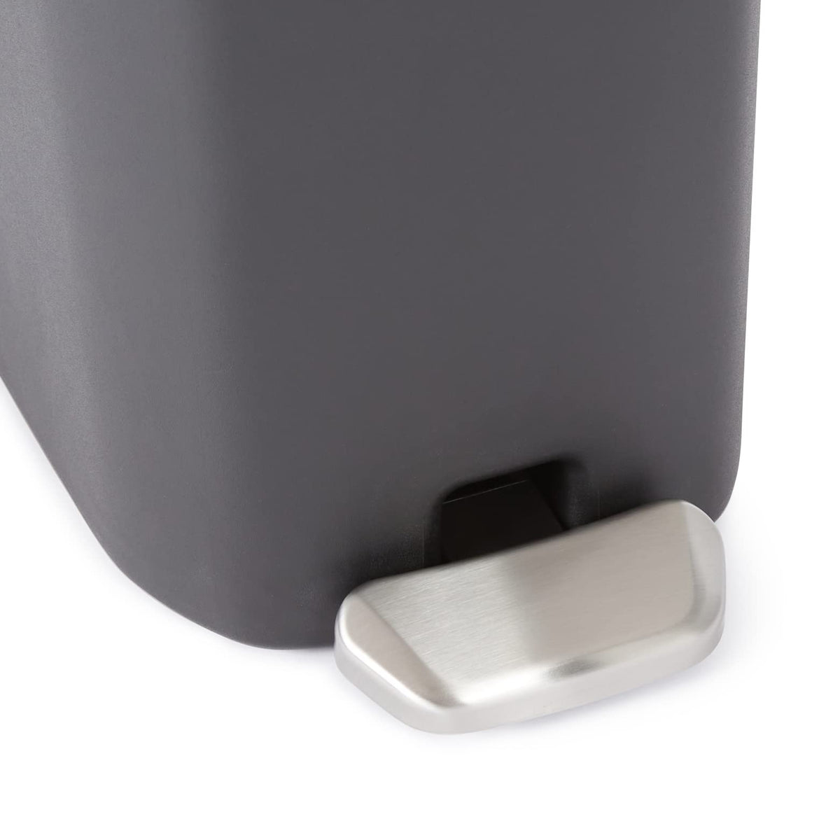 Amazon Basics compact trash can inner bucket removable for easy bag changes.