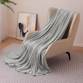 Amazon Basics cooling blanket on queen bed for cooler nights.