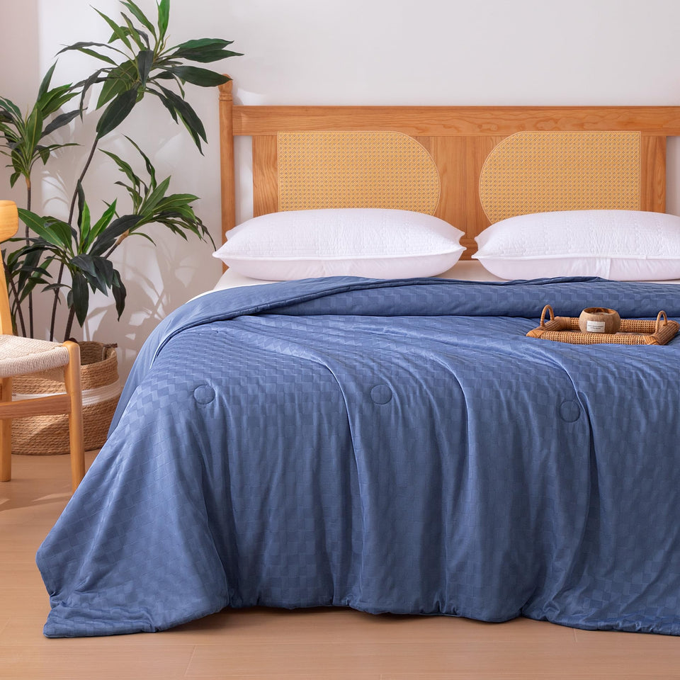 Amazon Basics cooling comforter shows waffle jacquard texture for breathable sleep.