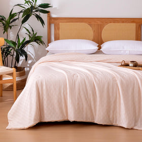 Amazon Basics cooling comforter with waffle jacquard for airflow and cool nights.