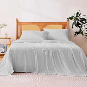 Amazon Basics cooling sheets fitted with a 15-inch pocket for deep mattresses, secure fit.