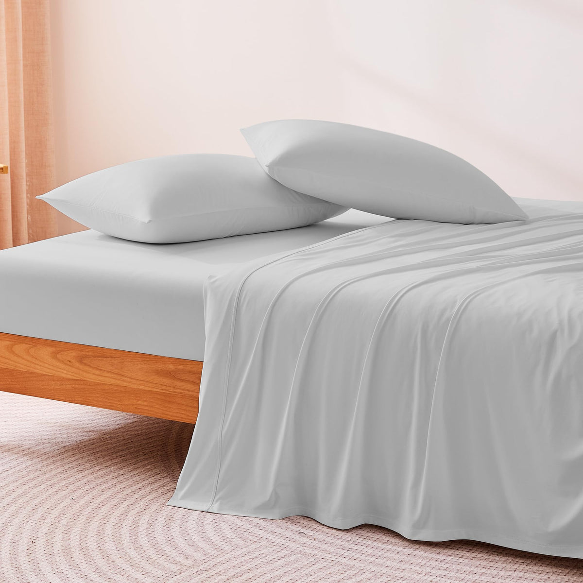 Amazon Basics king-size cooling sheets on bed with 15-inch deep pockets.