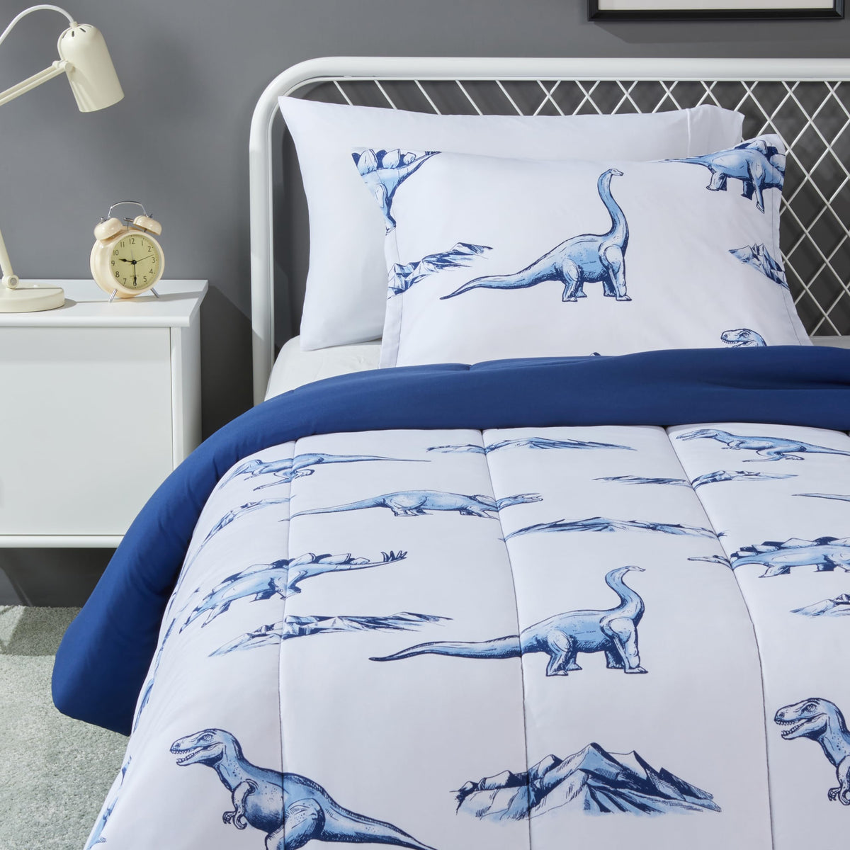 Amazon Basics dinosaurs comforter on a kid's bed provides cozy warmth