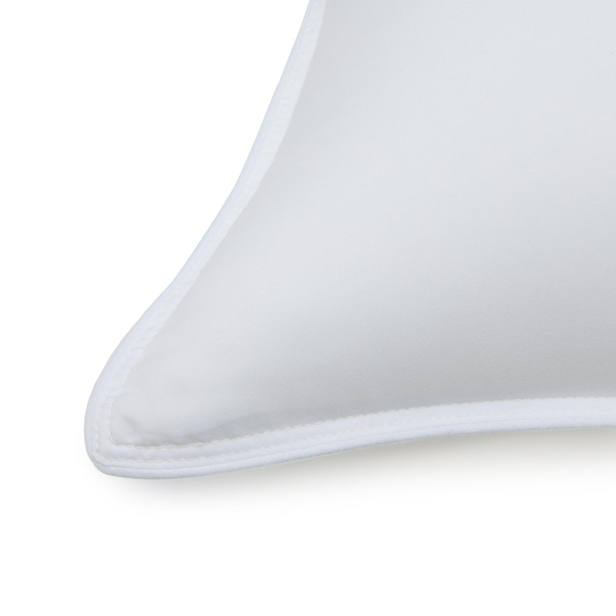 Amazon Basics pillow edge piping; reinforced edge helps maintain shape over time.