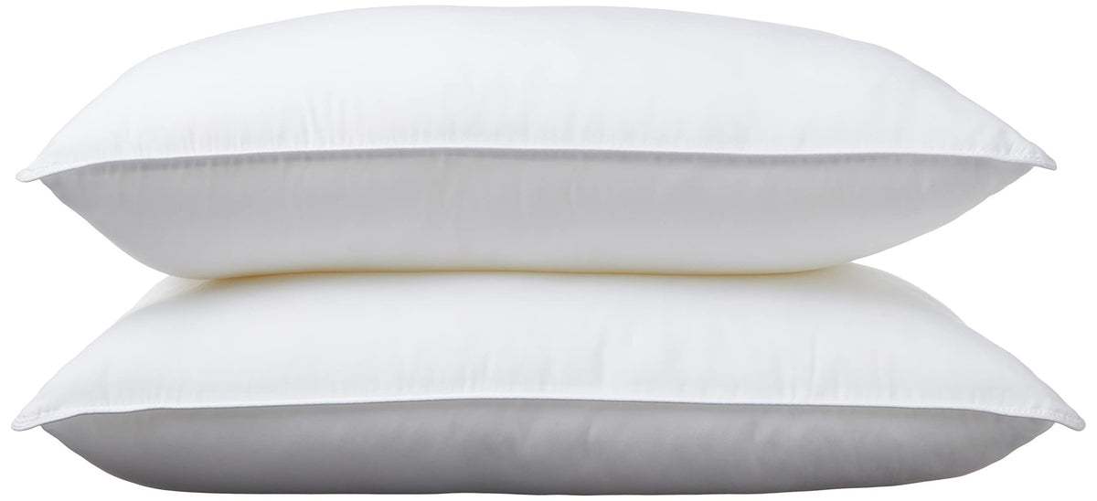 Amazon Basics pillow packaging shows value for a 2-pack for a complete bed setup.