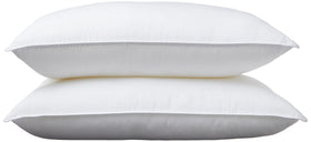 Amazon Basics pillow packaging shows value for a 2-pack for a complete bed setup.