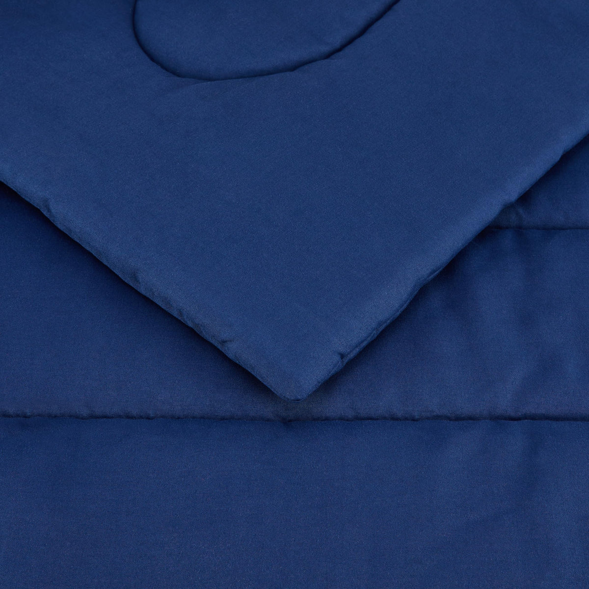 Amazon Basics navy kids bedding in a bright room; versatile color for mix-and-match.