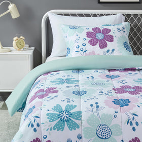 Amazon Basics kids comforter set on bed with purple flowers for playful sleep space