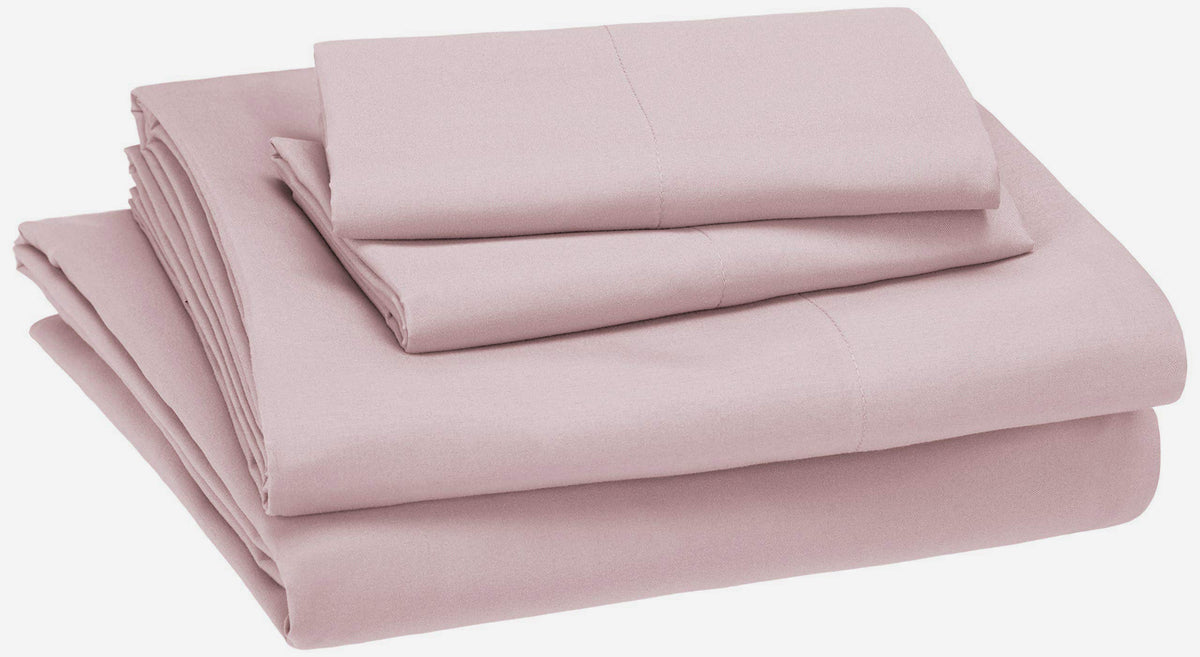Amazon Basics kid's sheet set light pink fitted sheet for a secure fit.