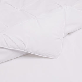 Amazon Basics pinch-pleat edges add subtle elegance to a contemporary bedroom.