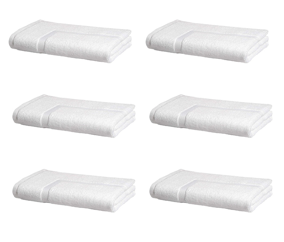 Amazon Basics premium cotton bath mat set in a hotel bathroom offering soft absorbency.
