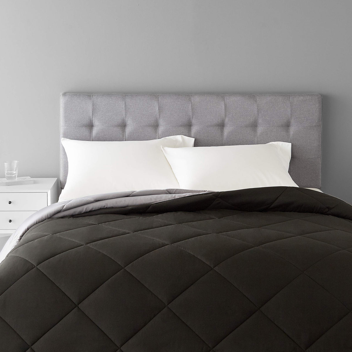 Amazon Basics reversible all-season king comforter in black and grey offering two looks for flexible styling.