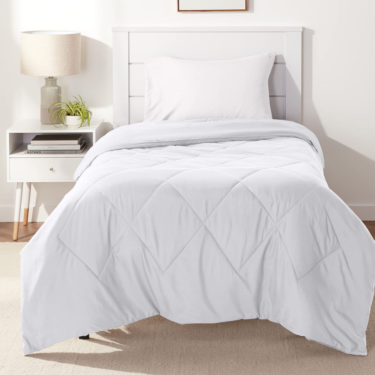 Amazon Basics reversible microfiber comforter Twin XL white showing dual-season warmth