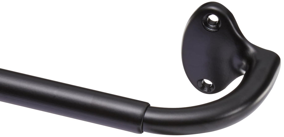 Amazon Basics room darkening curtain rod with curved wraparound ends blocks light for daylight use.