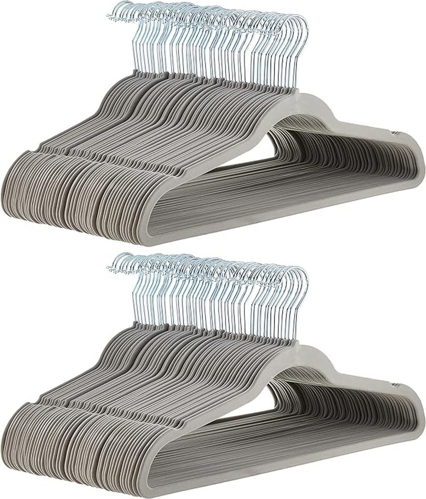 Amazon Basics slim velvet non-slip hanger in gray demonstrates compact space-saving design.