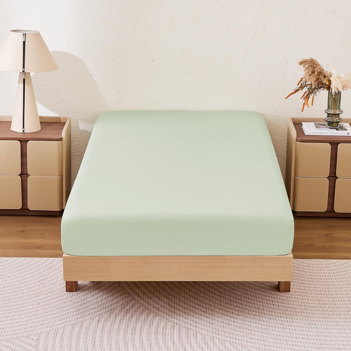 Amazon Basics Aloe Green queen fitted sheet on bed, soft microfiber feel and two-pack convenience.