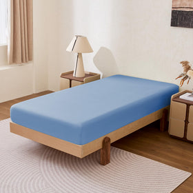Amazon Basics sheet on mattress showing 14-inch deep pocket for secure fit.