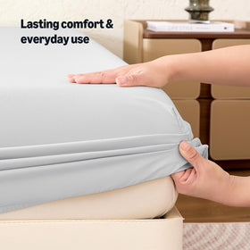 Amazon Basics fabric texture close-up shows soft, comfortable sleep surface.