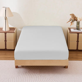 Amazon Basics queen gray fitted sheet folded, showing soft recycled polyester fabric.