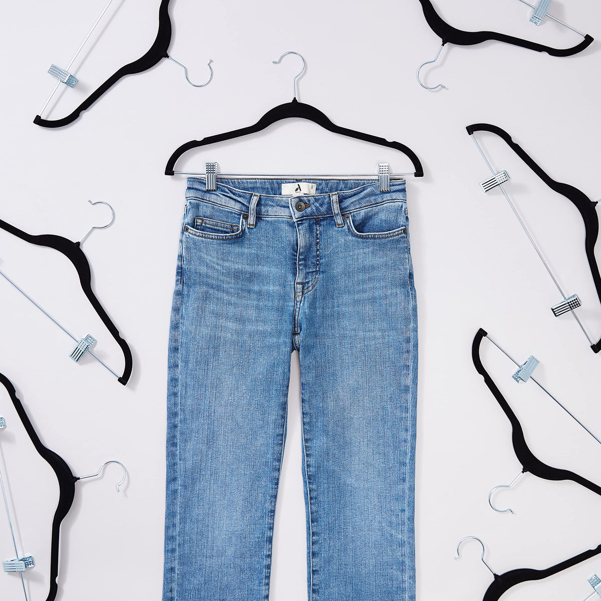 Amazon Basics velvet skirt hanger with clips non-slip velvet surface keeps garments in place.