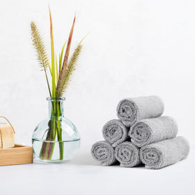 Amazon Basics gray washcloth on a bathroom counter suggests versatile cleaning and personal care.