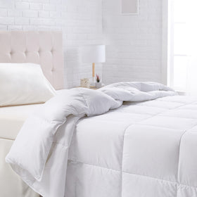 Amazon Basics white down-alternative comforter with corner tabs offers all-season warmth.