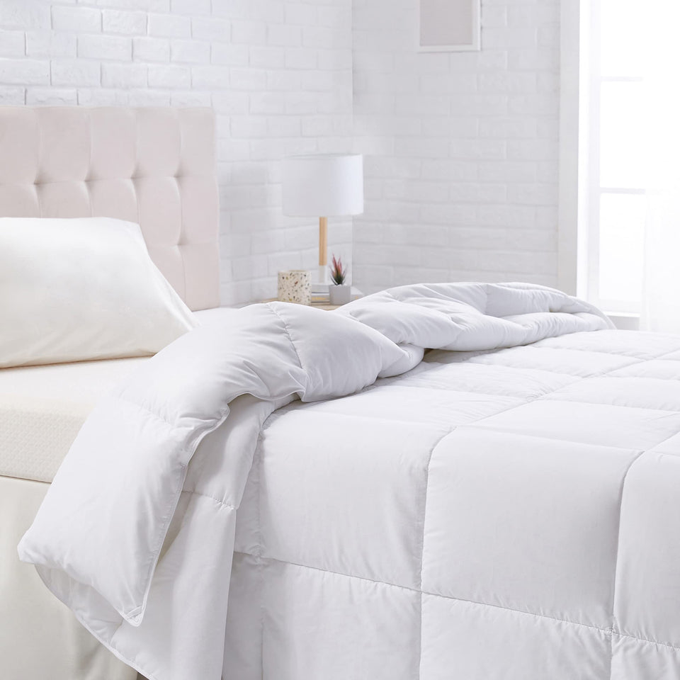 Amazon Basics white down-alternative comforter with corner tabs offers all-season warmth.