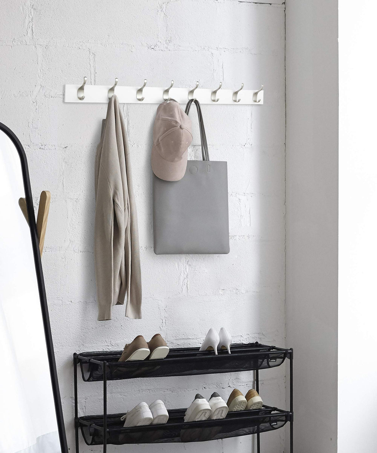 White finish coat rack by Amazon Basics fits bedrooms and closets