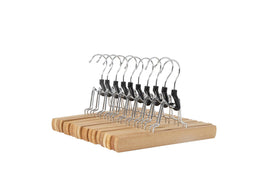 Amazon Basics wooden pants hanger with smooth finish keeps trousers neatly organized.