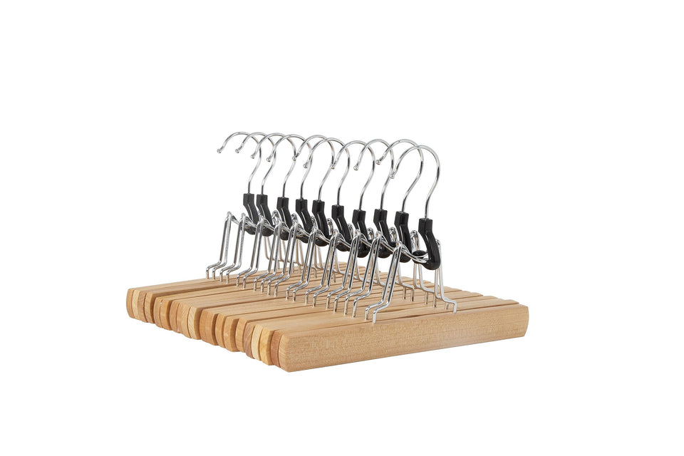 Amazon Basics wooden pants hanger with smooth finish keeps trousers neatly organized.