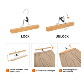 Amazon Basics wooden pants hanger with natural finish stacks neatly in closet.
