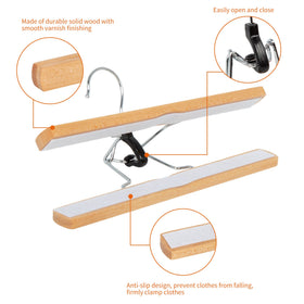 Amazon Basics wooden pants hanger fits standard closet rails for easy organization.