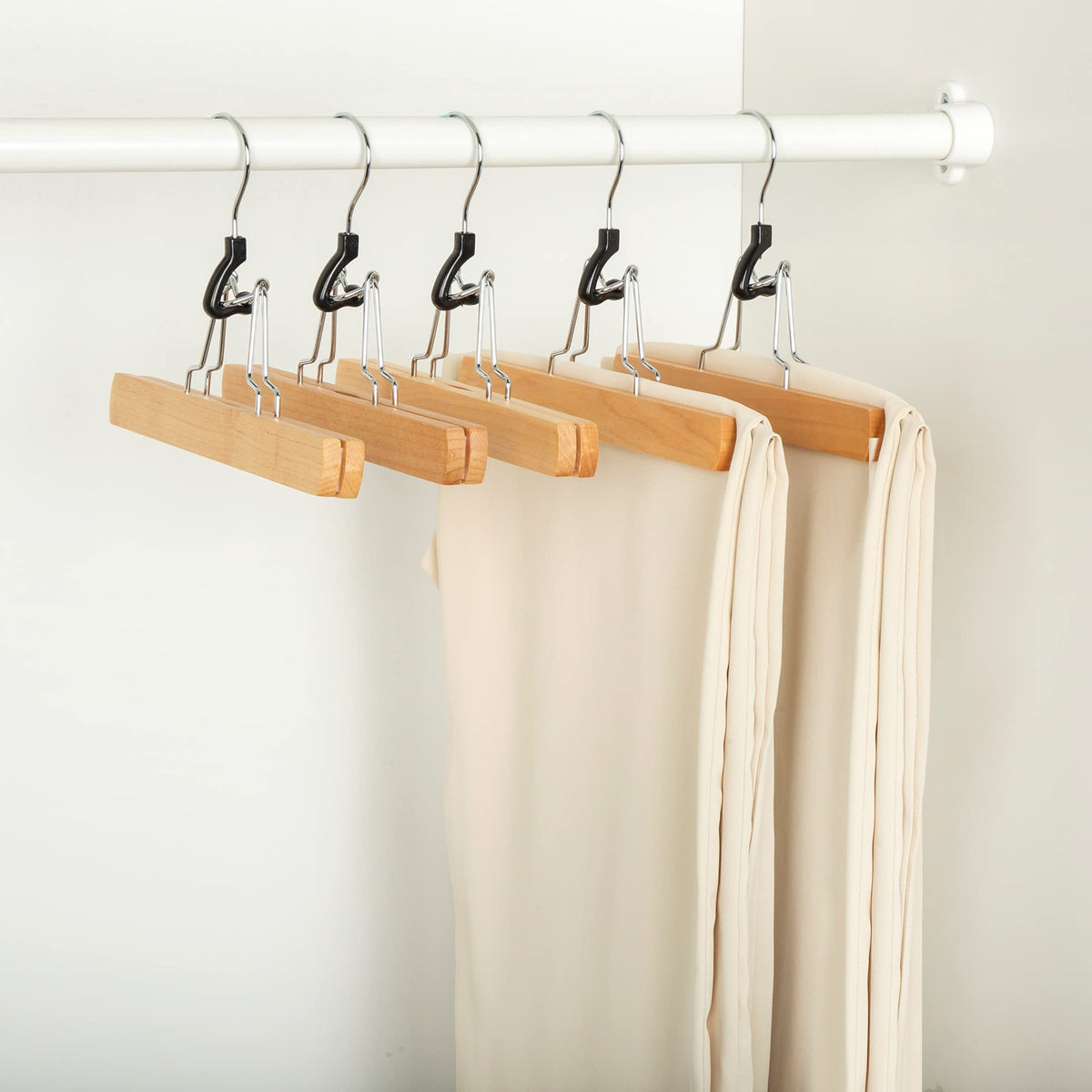 Amazon Basics wooden pants hanger keeps jeans and slacks wrinkle-free.