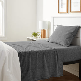 Amazon Basics flat sheet from twin set shows soft, breathable cotton jersey.