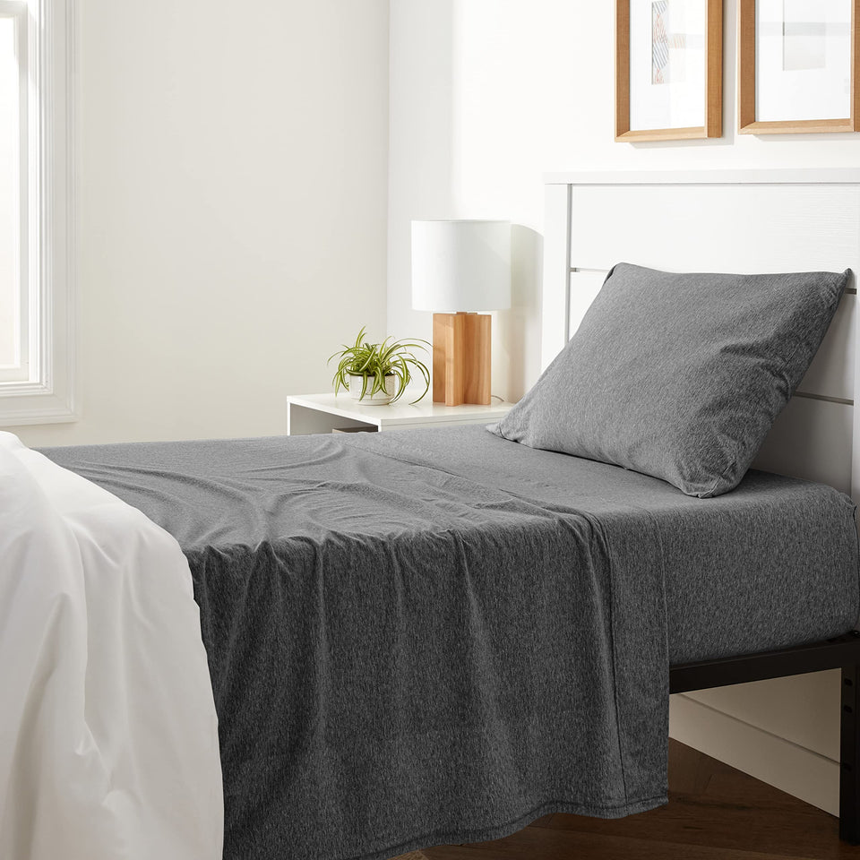 Amazon Basics flat sheet from twin set shows soft, breathable cotton jersey.