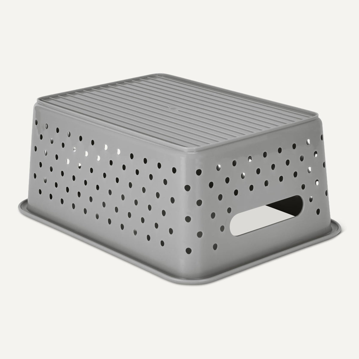 Amazon Basics grey storage basket organizing bathroom or office items.