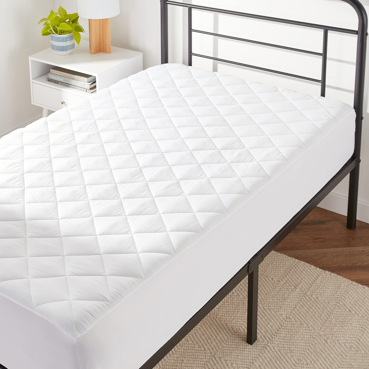amazon basics hypoallergenic quilted topper close-up showing breathable fabric for allergy relief